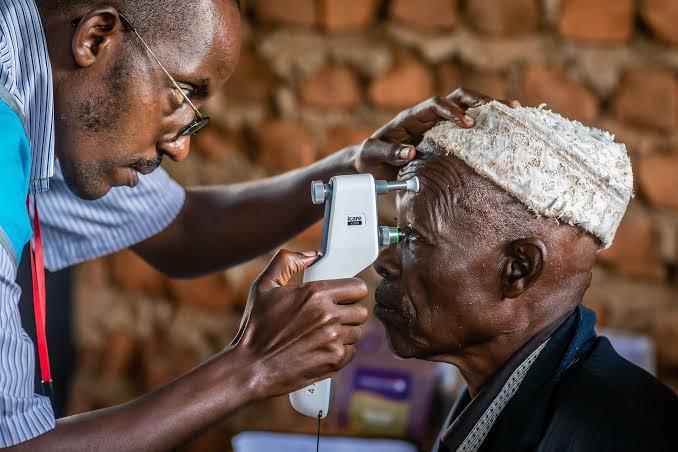 Eye care professional examining patient